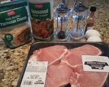 A picture of step 2 of Parmesan crusted pork chops.