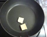A picture of step 7 of New Potatoes and Pork with Rich Butter Soy Sauce.