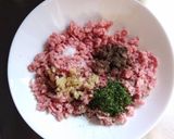 A picture of step 1 of Grandma's Meatballs - with Tomato Oregano Sauce.