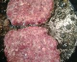 A picture of step 2 of Green tomatoes atop sausage.