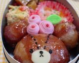 A picture of step 7 of Meat Wrapped Onigiri Rice Balls using Shabu-Shabu Pork Slices.