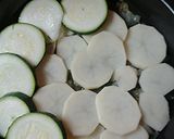 A picture of step 3 of French tomato, potato, zucchini bake.