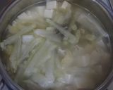A picture of step 3 of Daikon Radish Miso Soup with Small Dried Sardines.