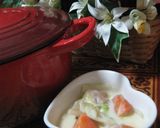 A picture of step 16 of Easy Rich Cream Stew in a Le Creuset Pot.