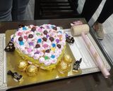 A picture of step 13 of Heart pinata cake.