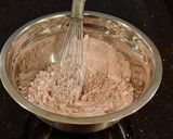 A picture of step 3 of Fresh Strawberry Chip Cake with Lemon Cream Frosting.