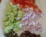 A picture of step 1 of Barley Rusks with Katiki Cheese and Greek Village Salad.