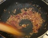 A picture of step 8 of Coconut rice with peas stwe.