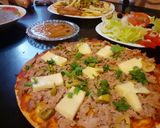 صورة لخطوة 2 من وصفة ميني بيتزا