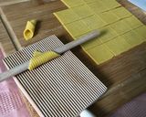 A picture of step 1 of Garganelli with Béchamel and Sausage.