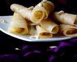 A picture of step 9 of Kheer'r Patishapta pithe (a traditional Bengali sweet delicacy).