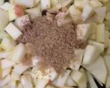 A picture of step 2 of Apple pie with flaky butter crust served with vanilla ice cream.