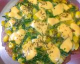 A picture of step 5 of Multi grain base spinach corn topped pizza.