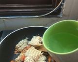 A picture of step 2 of Maggi with tomato onion.