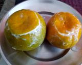 A picture of step 3 of Orange wedges icecream.