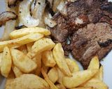 A picture of step 2 of My Well done Peppered Ribeye Steak with onions.