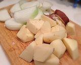 A picture of step 1 of Waterless Nikujaga (Simmered Meat and Potatoes) in a Staub Cocotte.