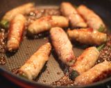 A picture of step 4 of Pork-Wrapped Okra.