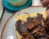 A picture of step 2 of Tostadas with Black Beans Fried in Pork Lard.