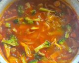 A picture of step 5 of Seafood Tomato Pasta Soup.