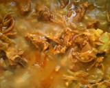 A picture of step 8 of Ragi mudda with mutton curry.