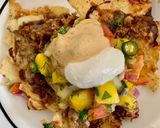 A picture of step 10 of Loaded Nachos with Mango Salsa, Sour cream and cheese sauce.