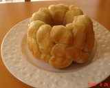 A picture of step 10 of Banana Yogurt Monkey Bread.