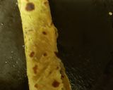 A picture of step 8 of Spinach stuffed avocado wrap .