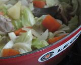 A picture of step 12 of Easy Rich Cream Stew in a Le Creuset Pot.