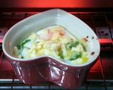 A picture of step 3 of Baked Cheesy Egg With Basil Sauce.