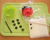 A picture of step 1 of Ladybug Onigiri Bento.