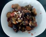 A picture of step 5 of My Roasted Sprouts in orange,crushed Walnuts and Cranberry sauce.