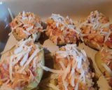A picture of step 6 of Sig's Tomato and potato mash filled potato boats.