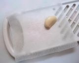 A picture of step 1 of Easy and Clean Way of Grating Ginger.