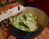 A picture of step 2 of Risotto with thick slices of zucchini.