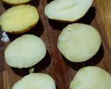 A picture of step 3 of "loaded" stuffed potato skins.