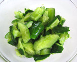 A picture of step 1 of Instant Bashed Cucumber Pickles with Shio-Konbu and Shiso leaves.