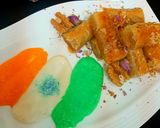 A picture of step 6 of Walnuts baklawa served with cream.