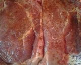 A picture of step 1 of Pepper floured pork chops.