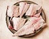A picture of step 1 of Mother's Stewed Mackerel and Daikon Radish with Gochujiang Chilli Paste.