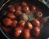 A picture of step 9 of Grandma's Meatballs - with Tomato Oregano Sauce.