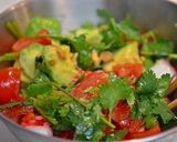 A picture of step 5 of Octopus, Avocado, and Tomato Salad with Cilantro.