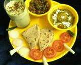 A picture of step 13 of Aloo akbari,masala bhindi with coriander buttermilk full platter.