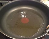 A picture of step 9 of Authentic Garlic Chicken in a Frying Pan.