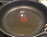 A picture of step 9 of Authentic Garlic Chicken in a Frying Pan.