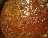 A picture of step 2 of rigatoni pasta and sauce baked.