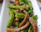 A picture of step 5 of Shishito Pepper, Wiener Sausage, and Garlic Sauté.