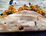 A picture of step 2 of Papad roll stuffed with green coriander and dry coconut.