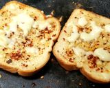 A picture of step 2 of Cheesy Garlic Bread toast.