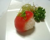 A picture of step 9 of Simple Temari Sushi Using a Pack of Sashimi.